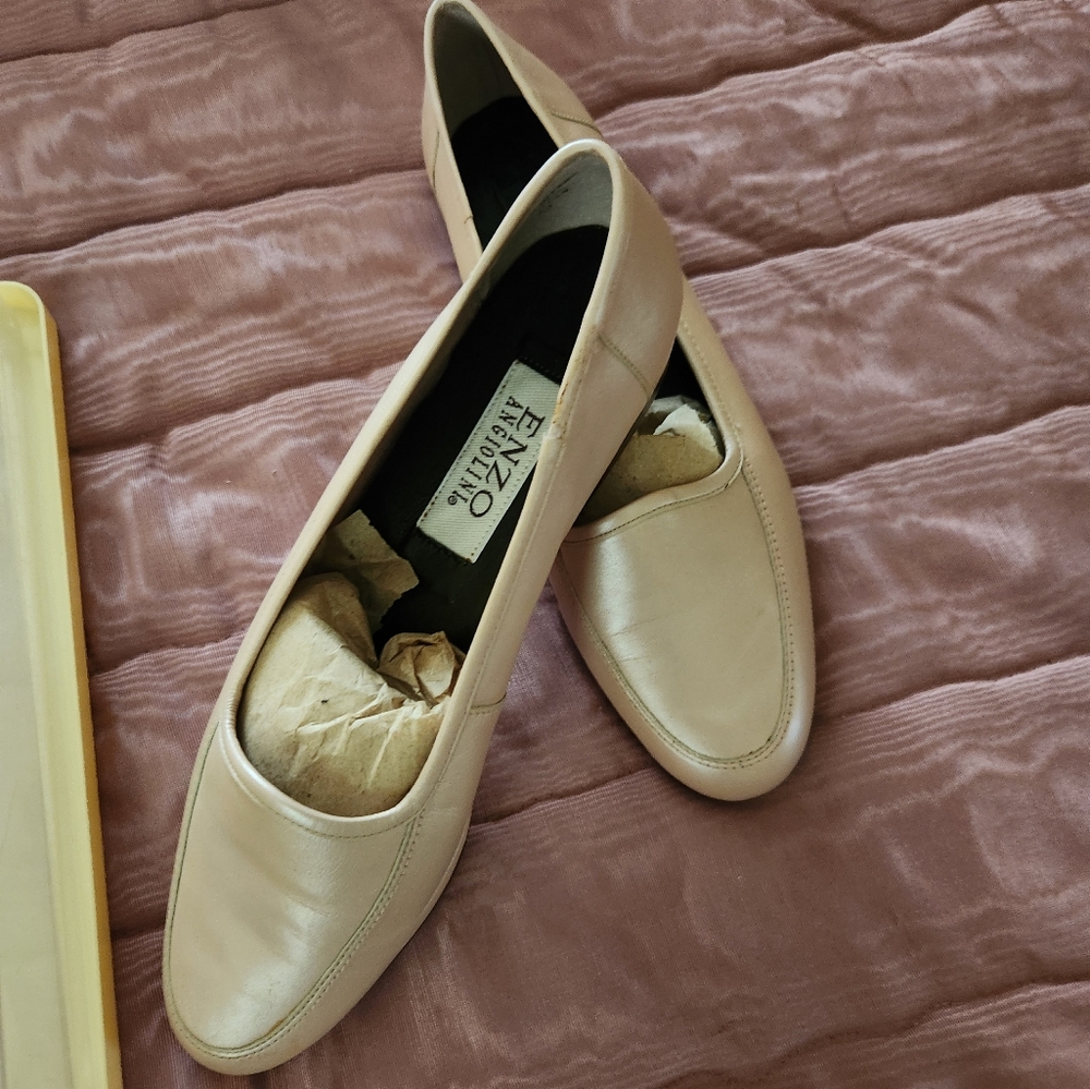 Low heel shrimp colored slip on shoes.